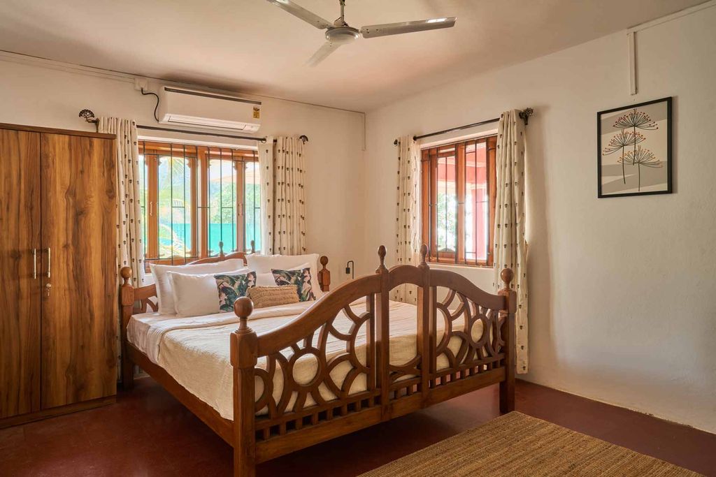 Bedroom with a carved wooden bed